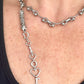 Upcycled Dior pendant necklace worn by model, adjustable silver-tone stainless steel chain