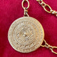 Close up on vintage Yves Saint Laurent scarf holder Gold textured signed Yves Saint Laurent 