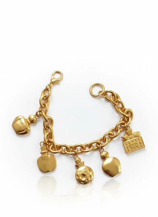 Full vintage Dior charm bracelet with gold-tone chain and perfume bottle–style charms