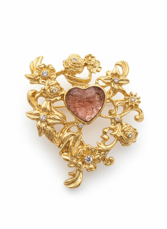 golden brooche with brown resin heart