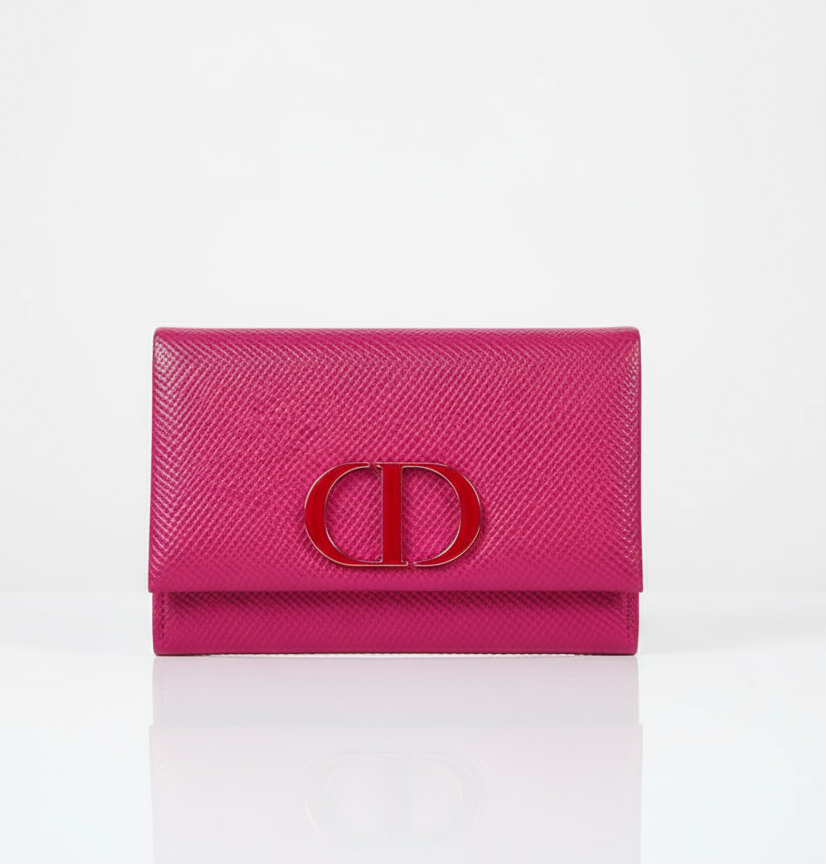 Pink wallet mirror from Dior with a CD logo on a white background