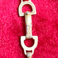 Authentic Vintage 80’s Christian Dior two-tone necklace with ribbed accents displayed on a red velvet background