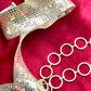 Side view of adjustable hoop links and toggle clasp of Paco Rabanne vintage pixel belt
