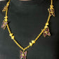 Worn by model Vintage 80s five Yves Saint Laurent Butterfly Enameled pendants mounted on a Nina Ricci gold necklace 