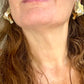 Close up in a woman wearing Authentic vintage Yves Saint Laurent earrings, organic gold-tone flower design with pearl accents