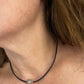 Worn by model YSL vintage silver earrings and matching pendant necklace set placed together 