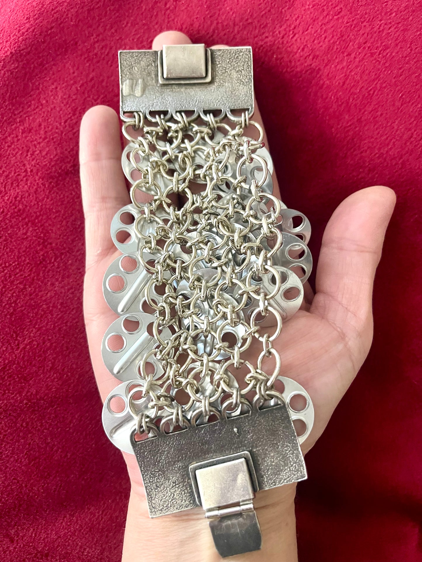 Back view Paco Rabanne collectible jewelry bracelet movement placed on palm 