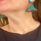 Yves Saint Laurent Rive Gauche vintage statement earrings with turquoise and red rhinestones worn by model showing the imperfections 