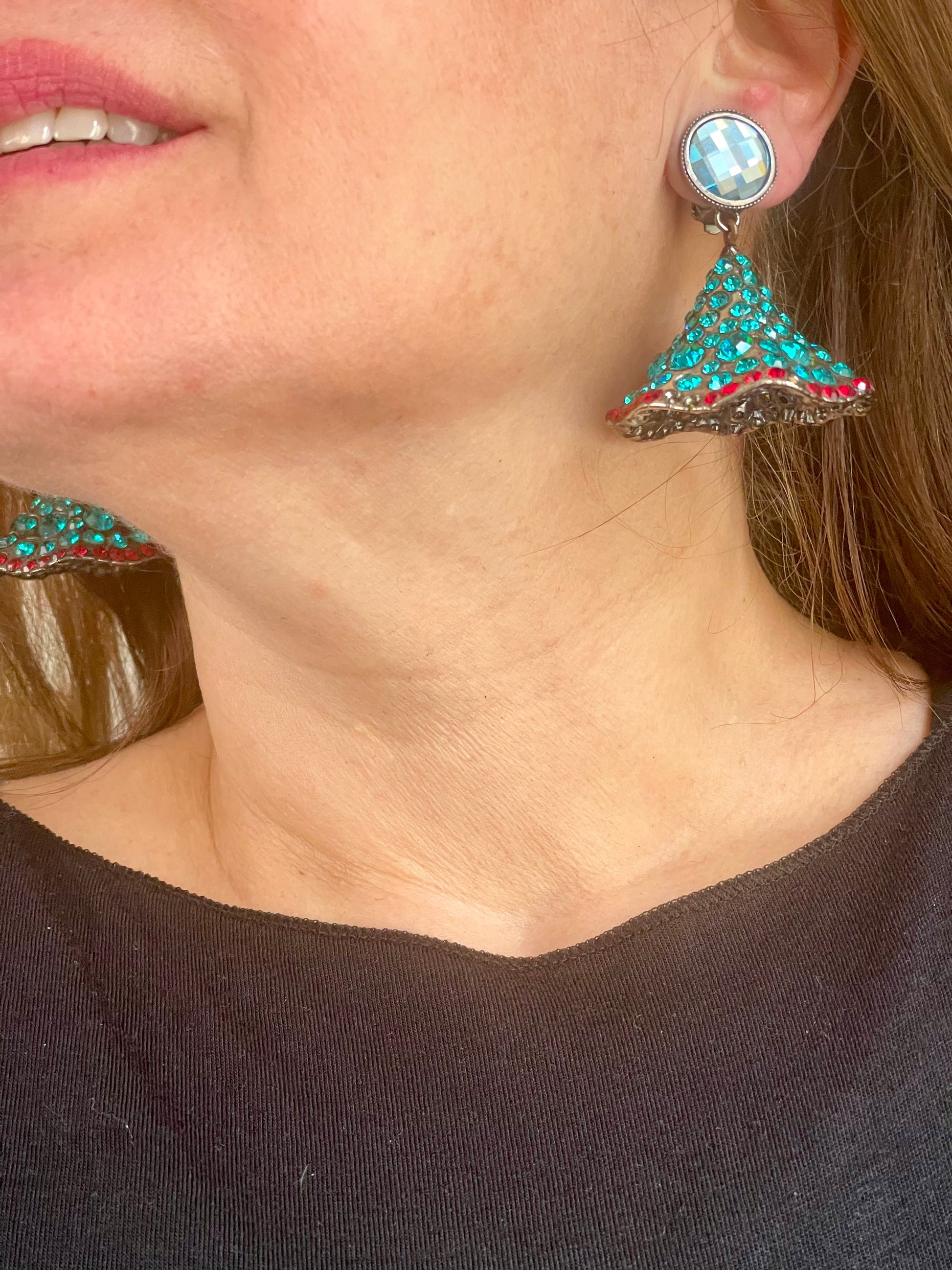 Yves Saint Laurent Rive Gauche vintage statement earrings with turquoise and red rhinestones worn by model showing the imperfections 