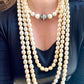 Yves Saint Laurent Vintage classic Faux Pearl Necklace grey white worn by model associated with a pearl necklace 
