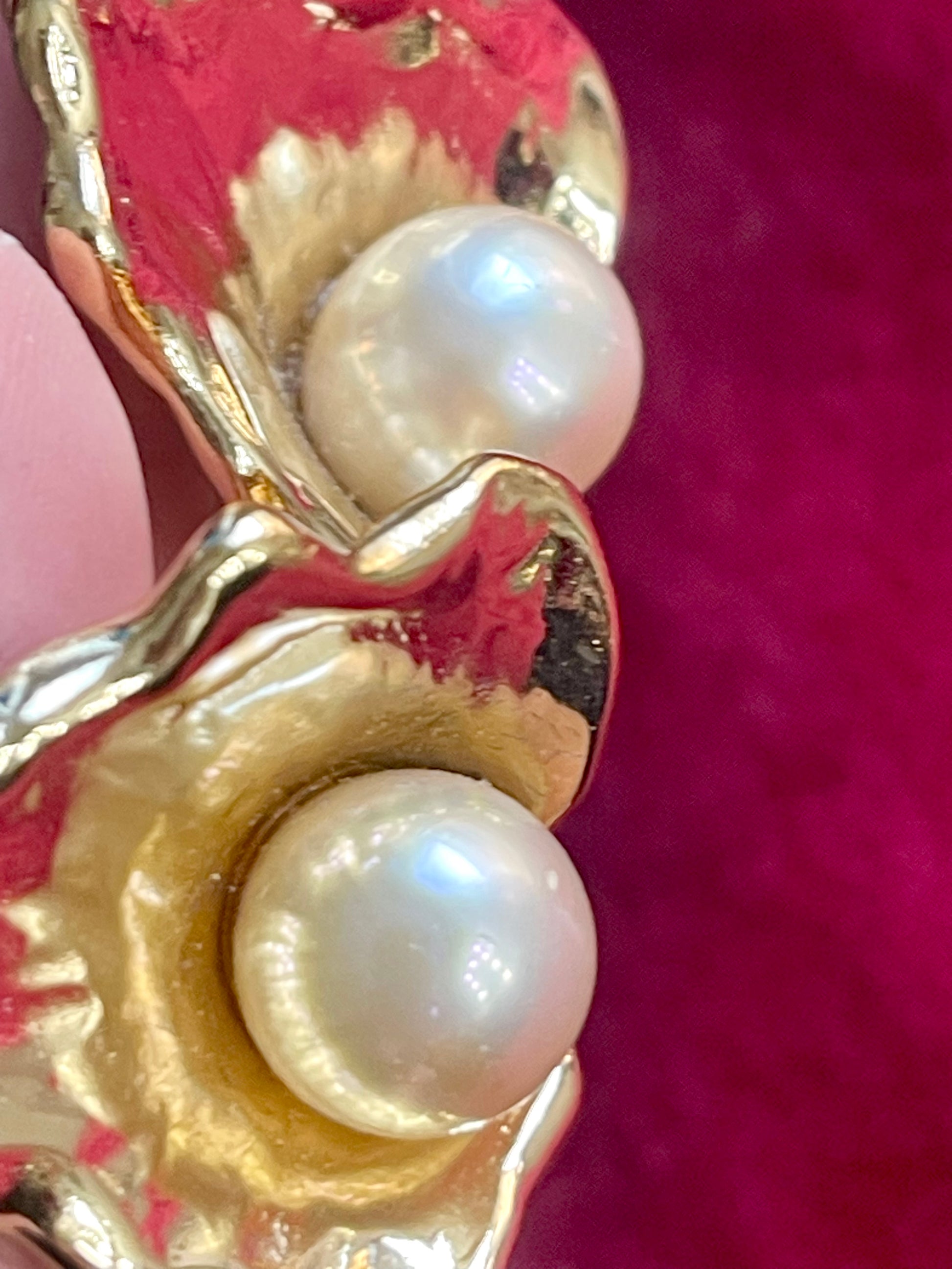 Close up details Authentic vintage Yves Saint Laurent earrings, organic gold-tone flower design with pearl accents