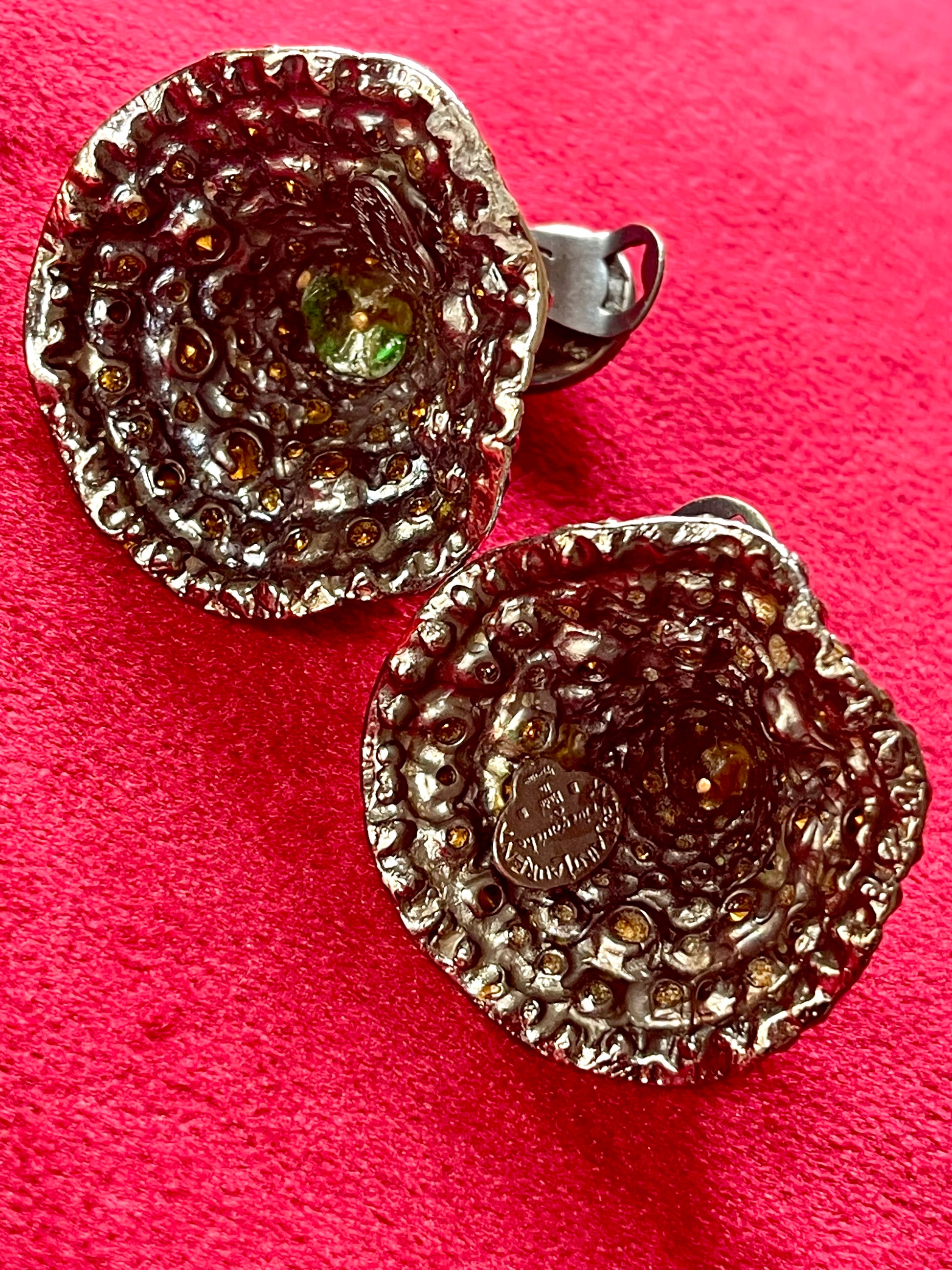 Close-up of Yves Saint Laurent Rive Gauche vintage statement earrings showing the diner authenticity tag