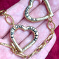 Front view closeup Vintage YSL heart pendants, minor signs of age visible