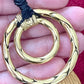 Close-up of vintage Yves Saint Laurent YSL gold tone scarf holder signed Made in France