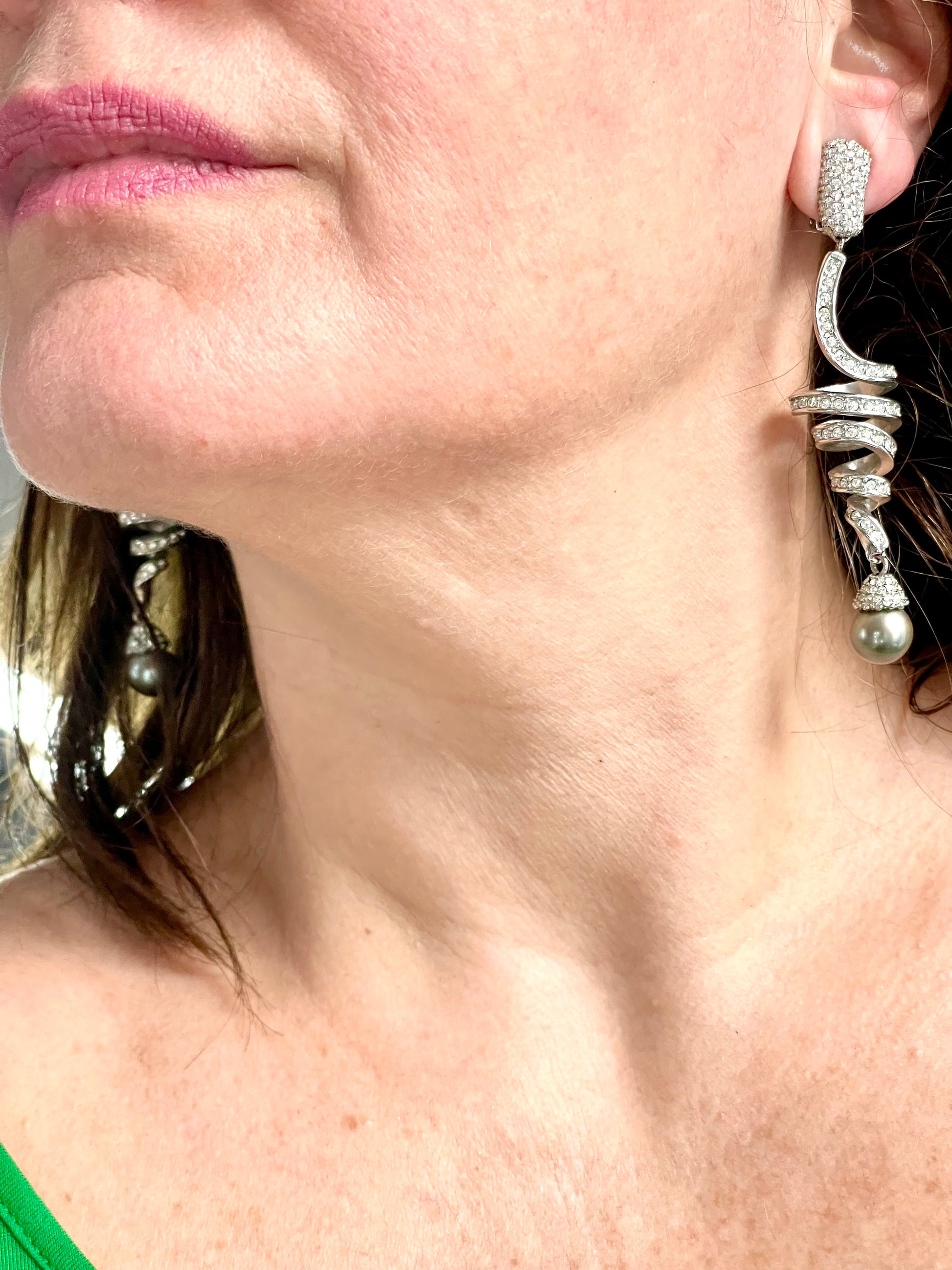 Grossé Dior earrings worn, showcasing elegant drop design and pearl detail