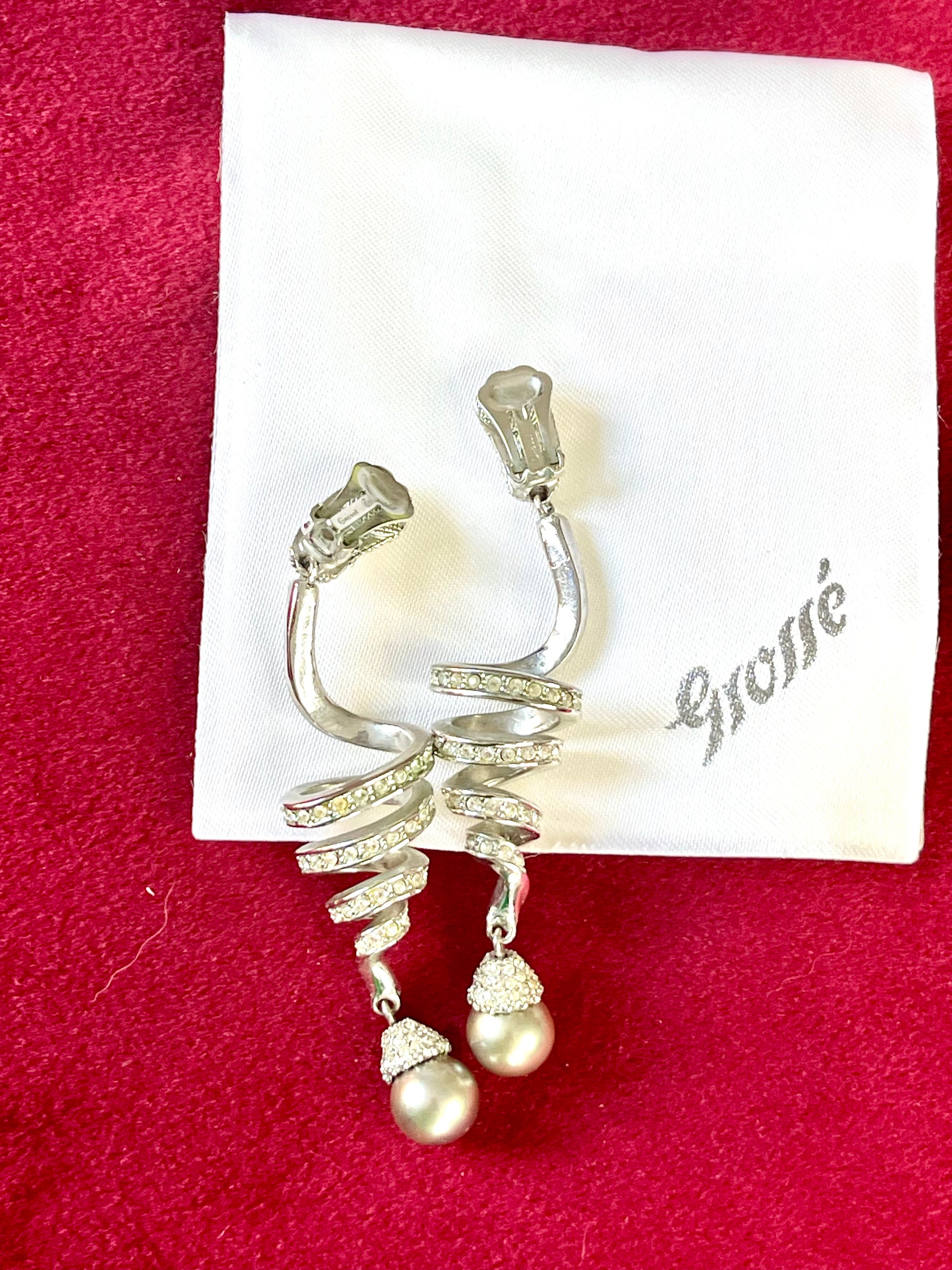 Back of Grossé Dior earring showing clip-on fastening in silver-tone metal.