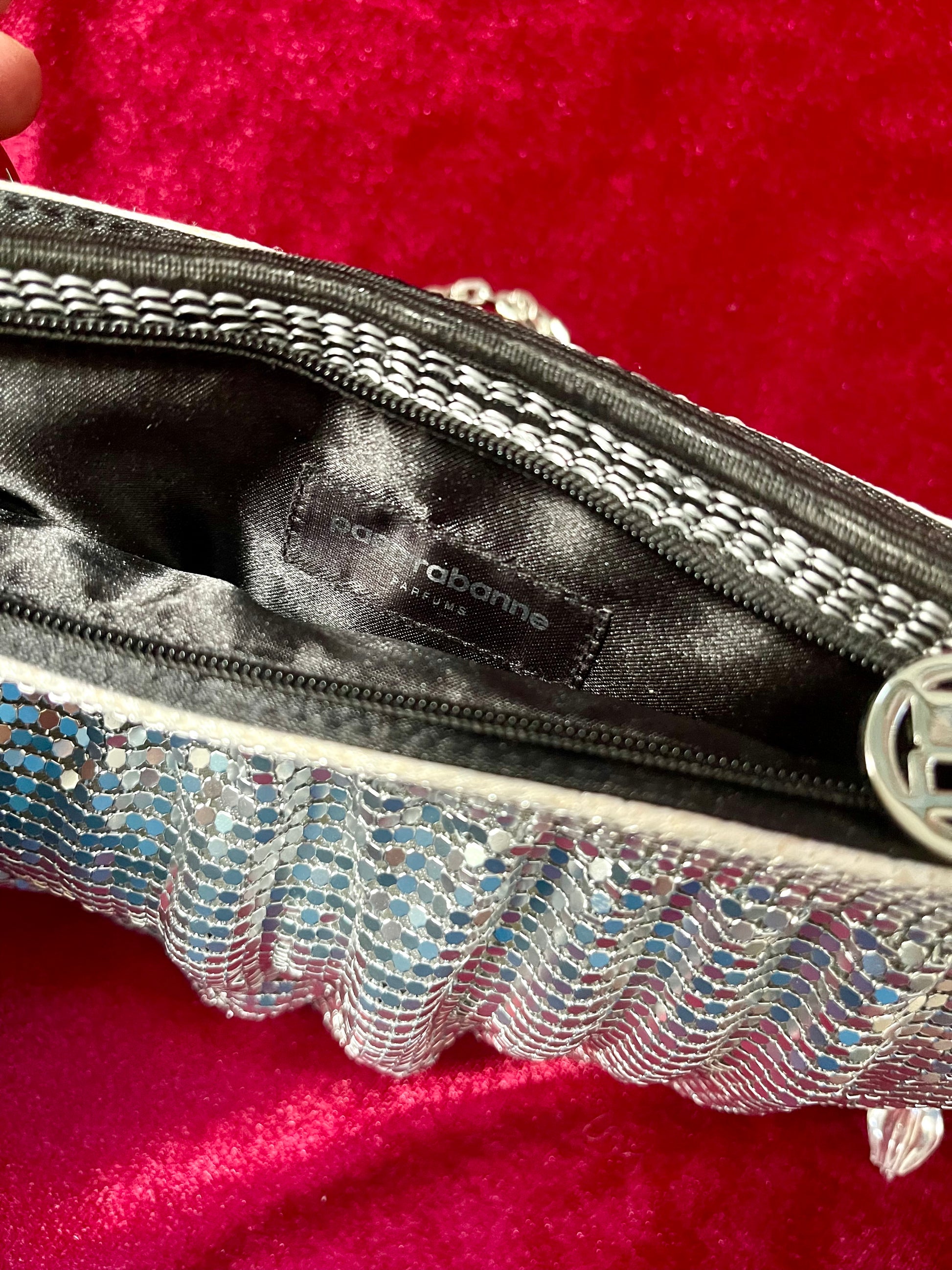 Tag view closeup of the One of a kind handmade Paco Rabanne repurposed silver pixel mesh bag