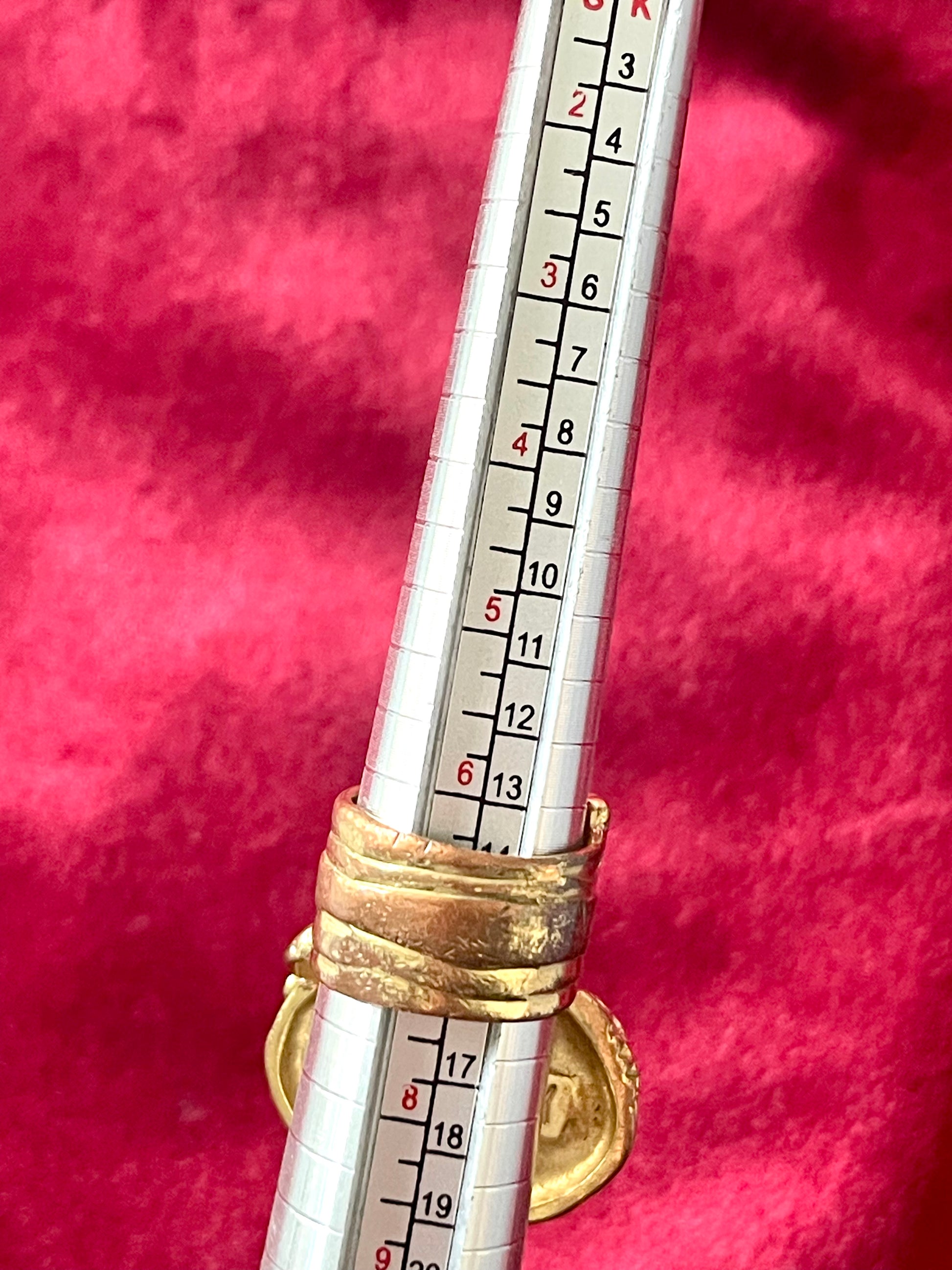 Measurement back side of a vintage YSL Arty ring showing the intricate textured gold band and raised turquoise nacre centerpiece.size 7 authentic signed Yves Saint Laurent 