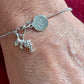 Pulsera Dior con dije de ángel en plata de ley