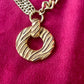 Close up on Yves Saint Laurent vintage 80s pendant  