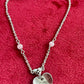 Vintage Dior silver tone rose beads chain bracelet with D charm signed on a red velvet background 