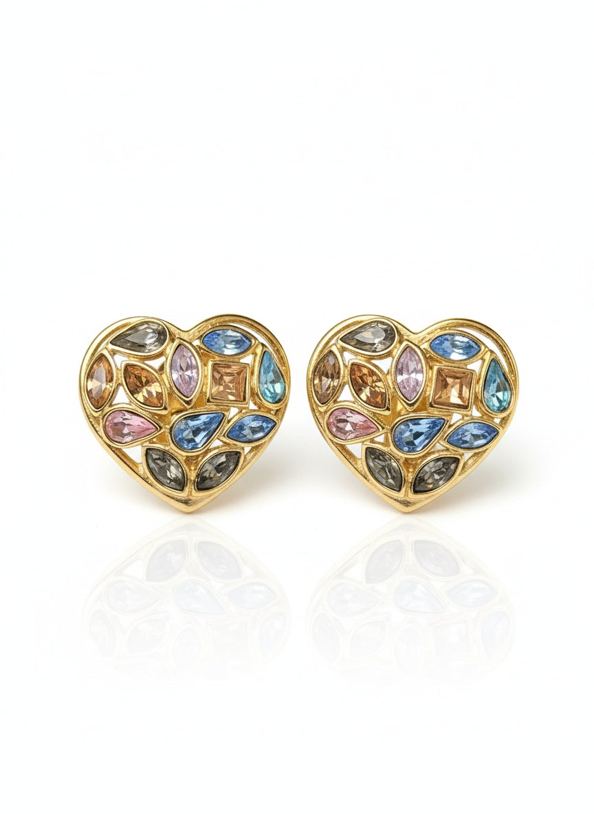 Heart-shaped vintage 80s Yves Saint Laurent earrings with multicolored gemstones on a white background