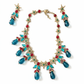 Green & red statement jewelry set style Yves Saint Laurent earrings necklace on a white background 