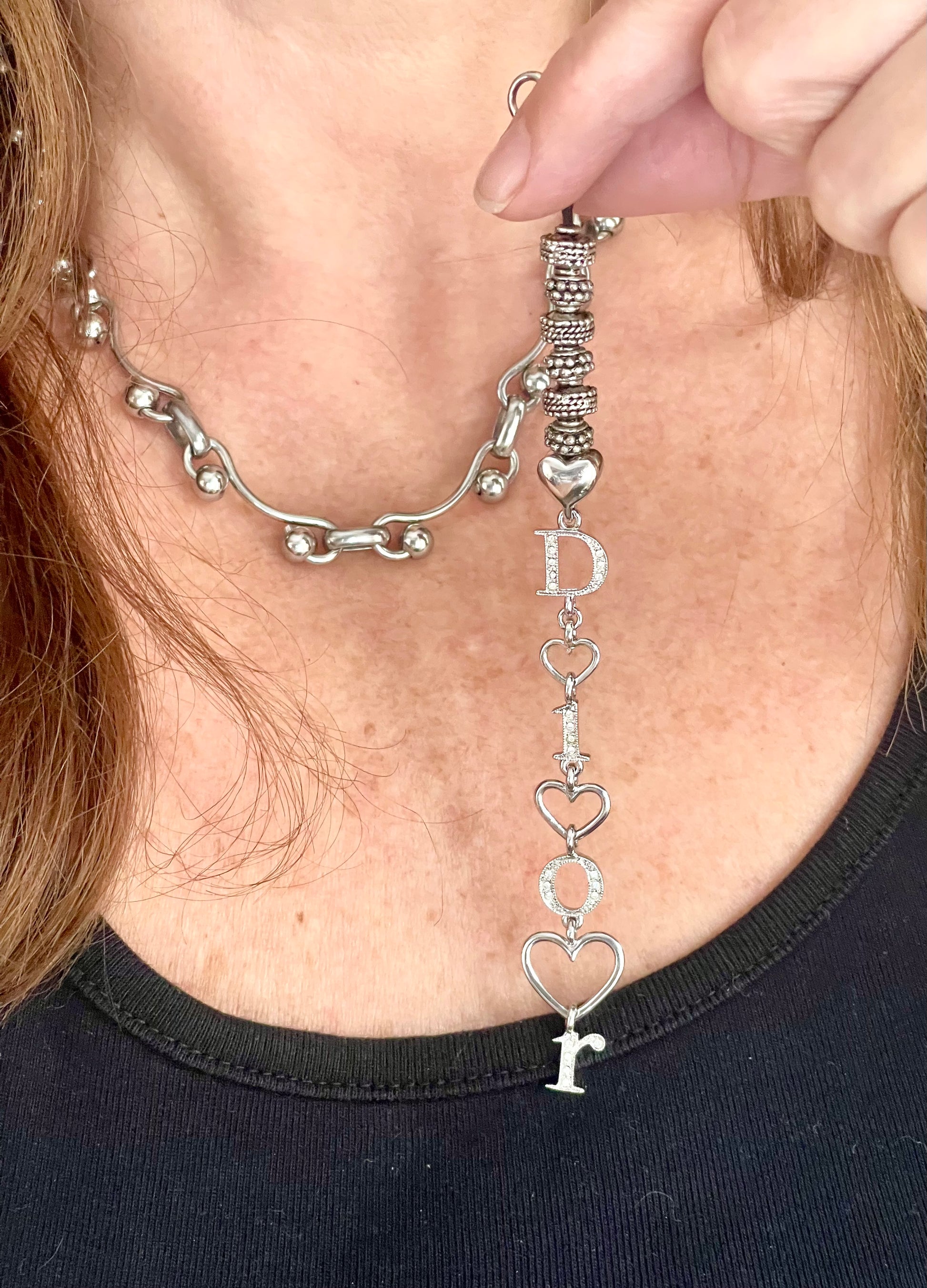 Model showing removable Upcycled Dior pendant on necklace silver-tone stainless steel chain