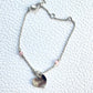 Vintage Dior silver tone rose beads chain bracelet with D charm signed  On a white background 