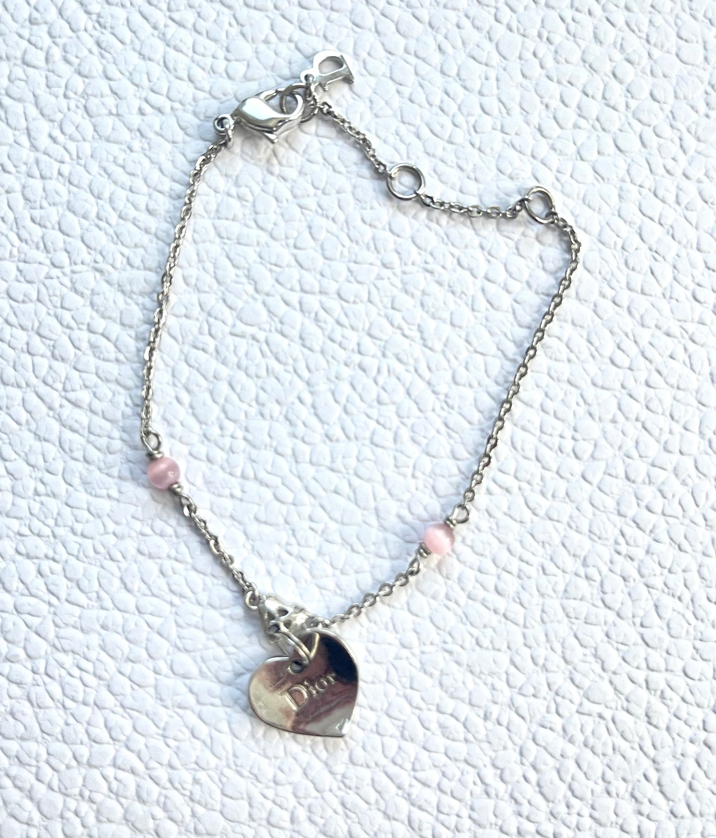 Vintage Dior silver tone rose beads chain bracelet with D charm signed  On a white background 
