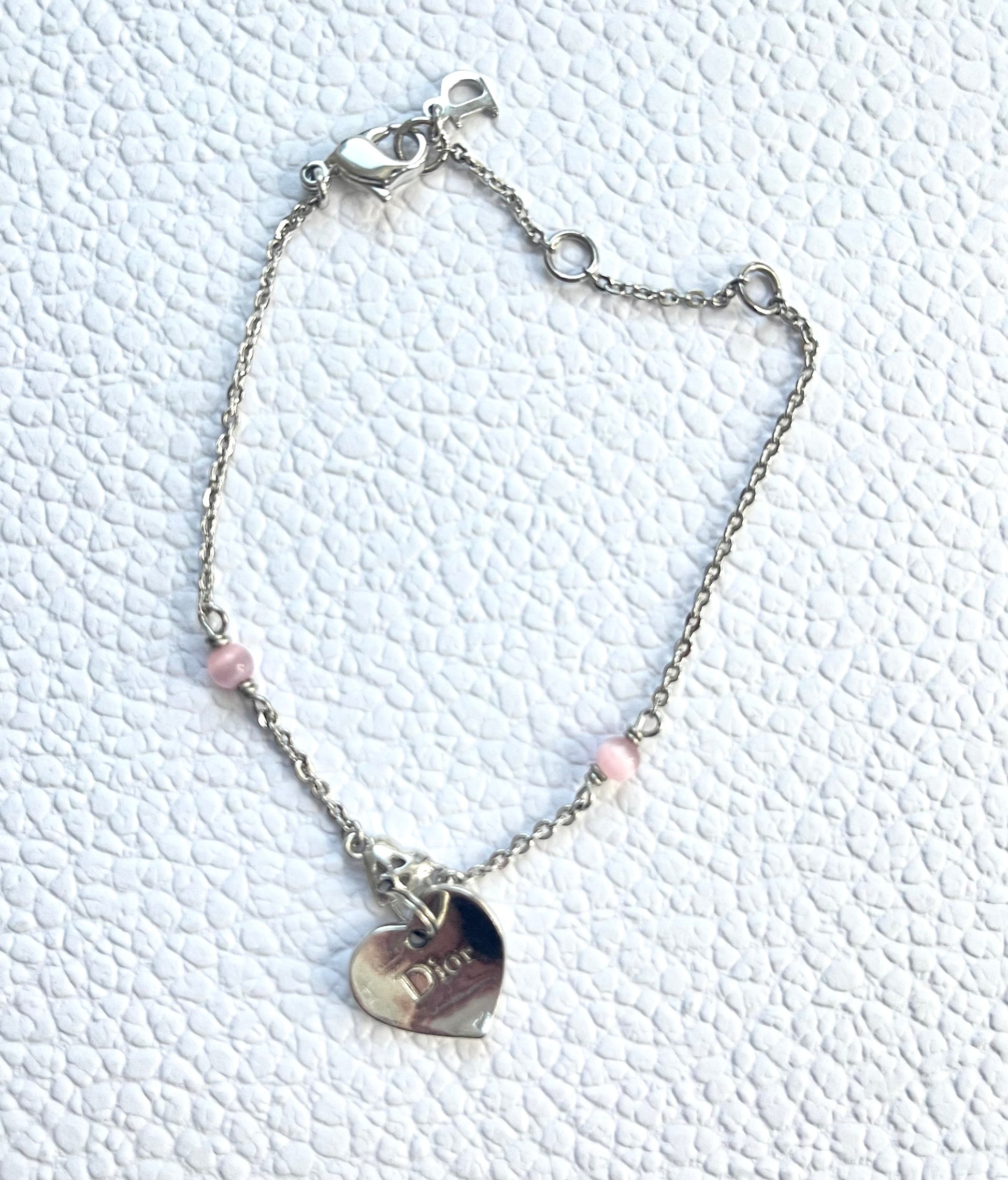 Vintage Dior silver tone rose beads chain bracelet with D charm signed  On a white background 