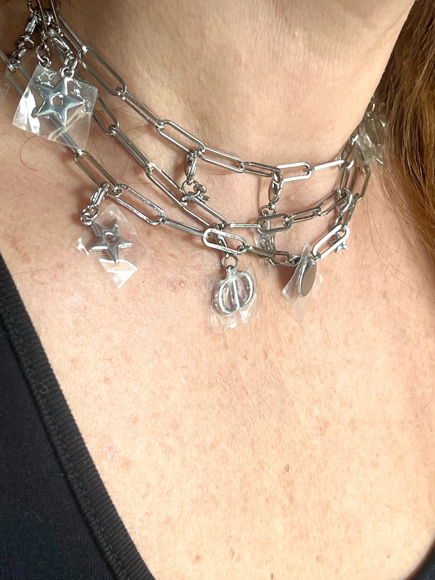 Choker style up close on upcycled Dior Beauté phone charm necklace with removable silver-tone charms