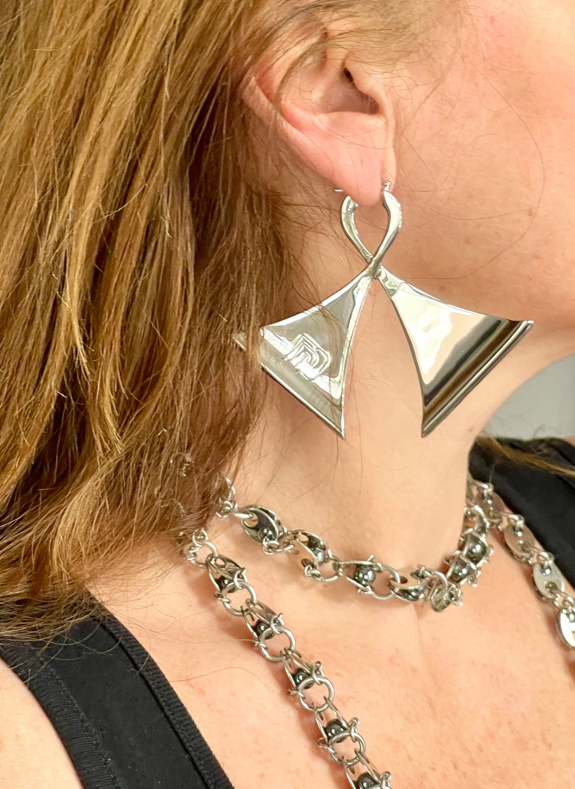 Right side worn by model Vintage Paco Rabanne silver-tone geometric sculptural statement earrings
