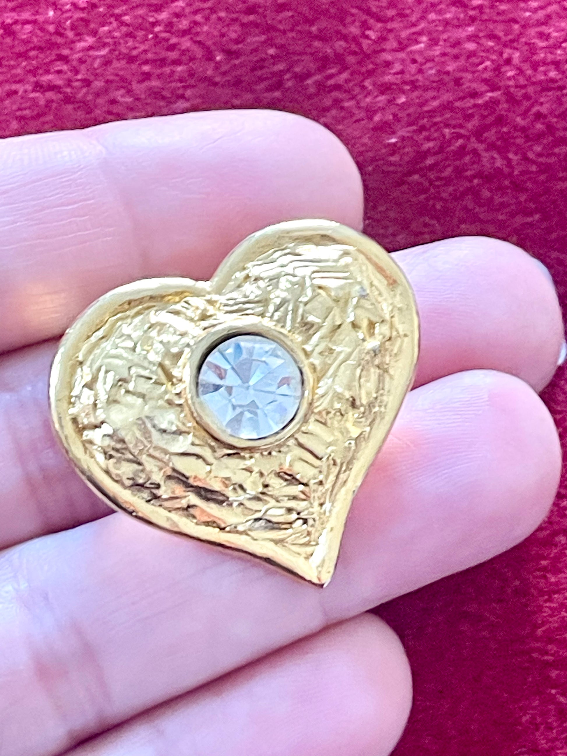 Close-up of rhinestone detail on Édouard Rambaud wave-design brooch