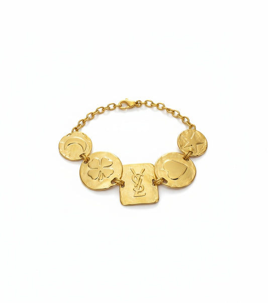 Gold bracelet yves saoint laurent with circular and square links on a white background