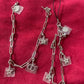 Before and after design of upcycled Dior Beauté phone charm necklace with removable silver-tone charms on red background 