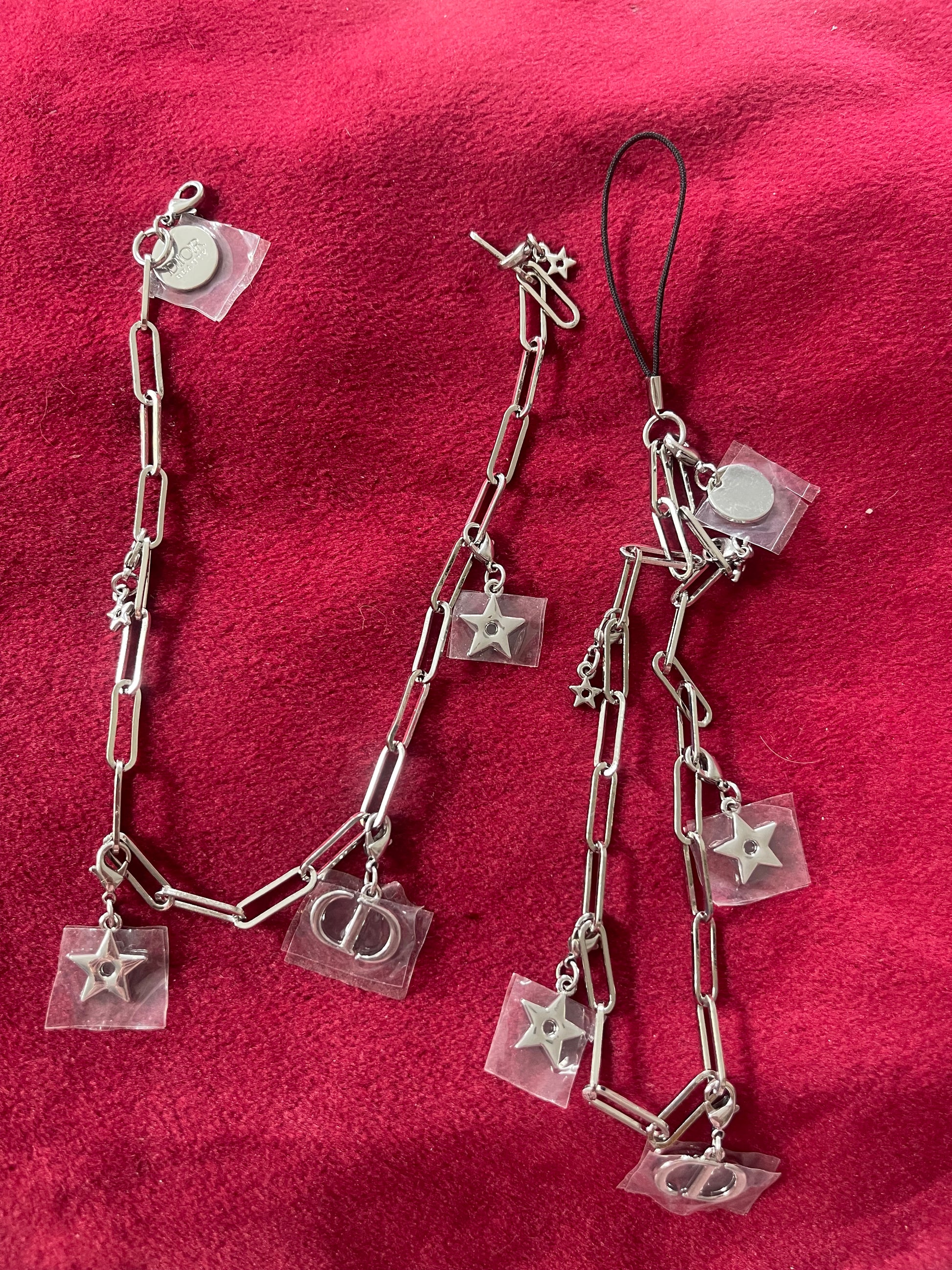 Before and after design of upcycled Dior Beauté phone charm necklace with removable silver-tone charms on red background 