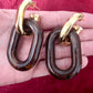 Boucles d'oreilles Paco Rabanne XL Link — Résine marron et métal doré (Collection 2025)