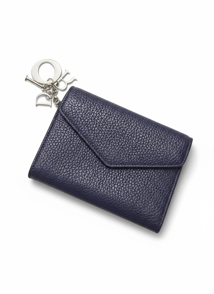 dior wallet with grain on white background