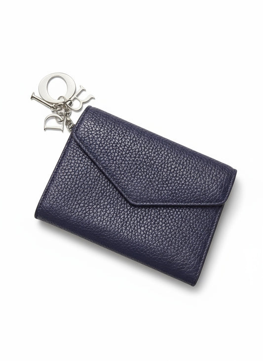 dior wallet with grain on white background