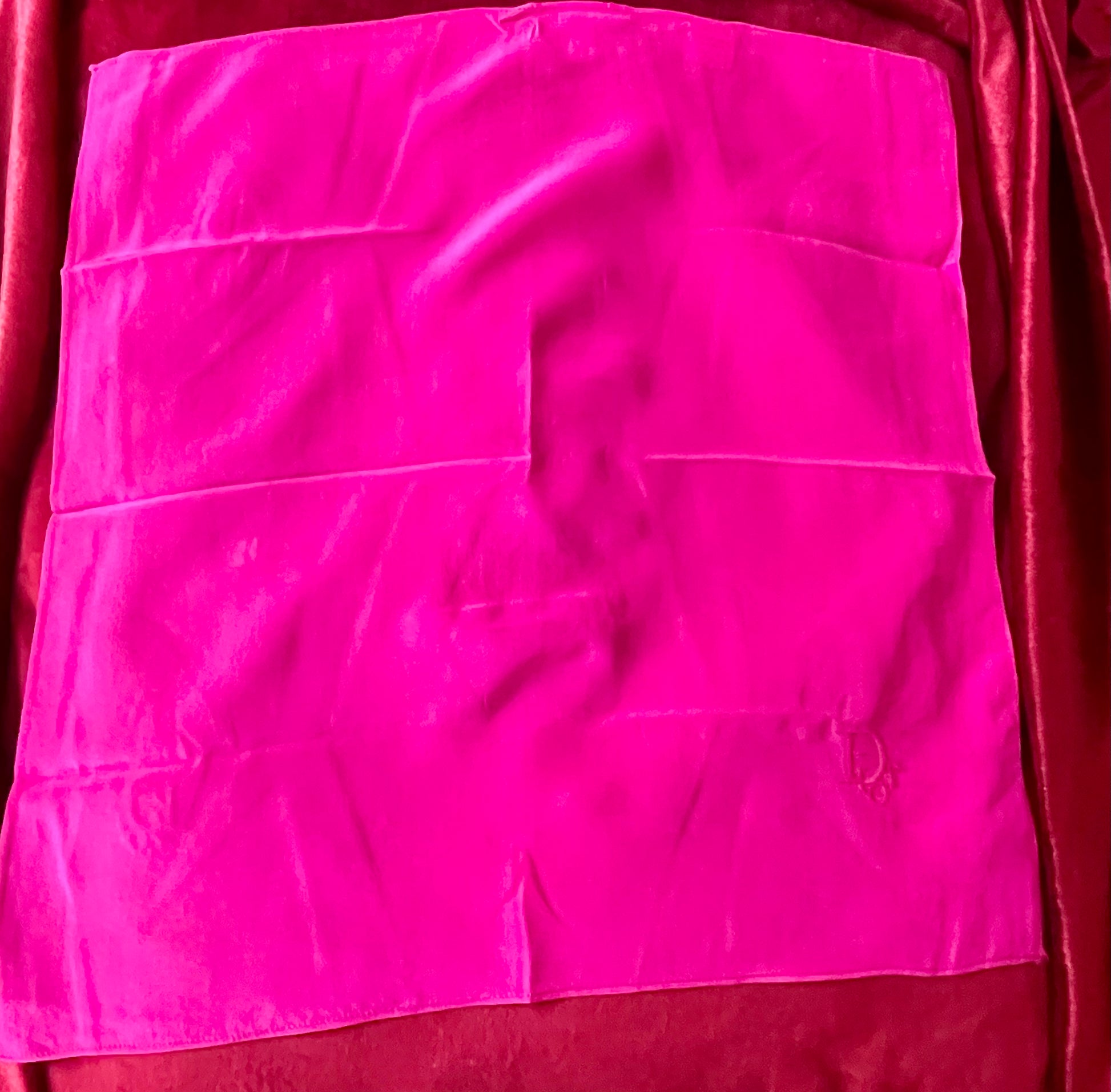 Vintage Dior pink silk scarf detail close-up With red fabric 