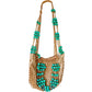 Full view of Paco Rabanne macramé shoulder bag with turquoise beads and zipper closure, hanging on a white background limited edition 