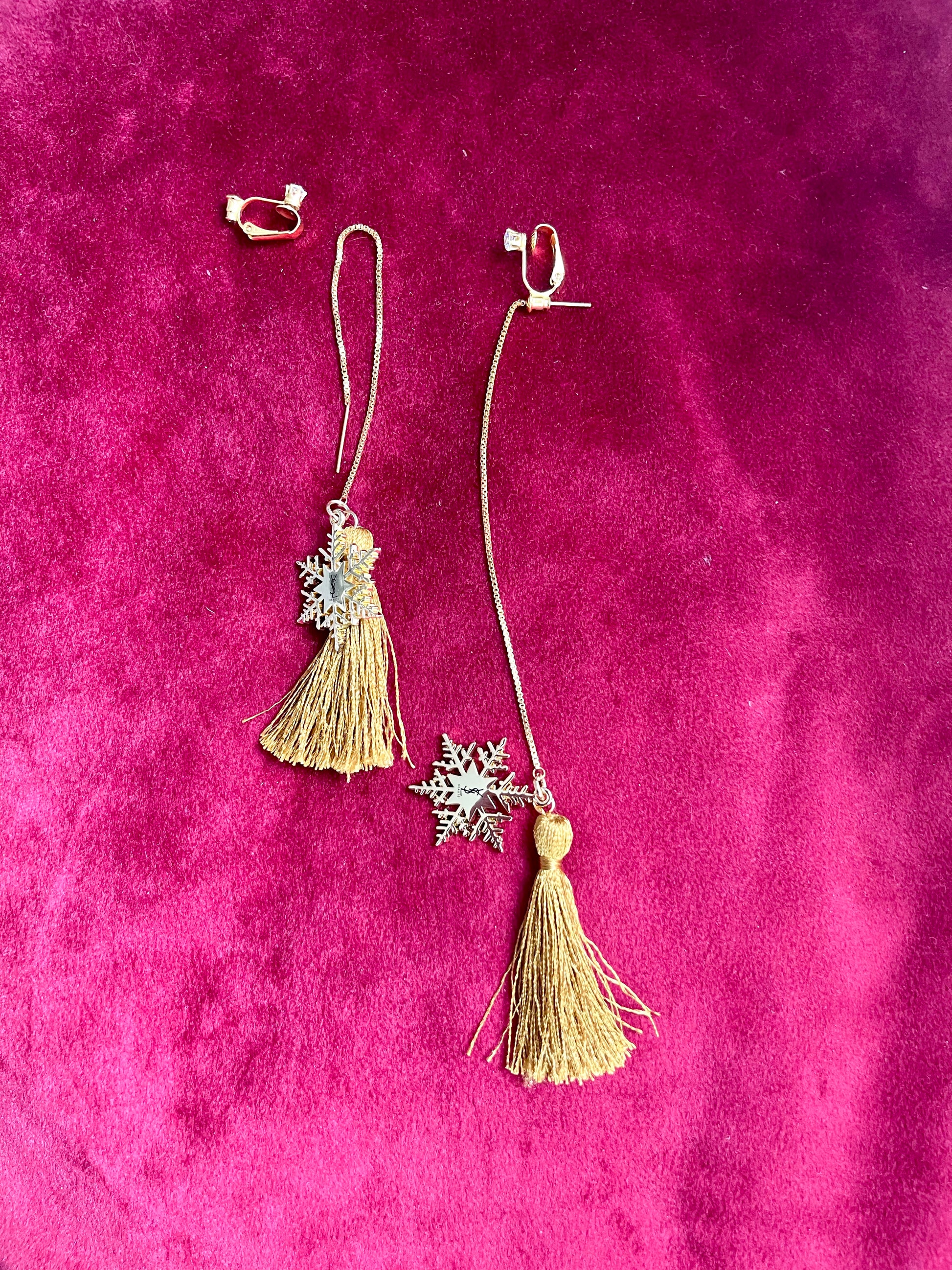 Yves Saint Laurent signed snowflake charm tassel earrings in gold tone, asymmetrical upcycled design with removable clip-ons