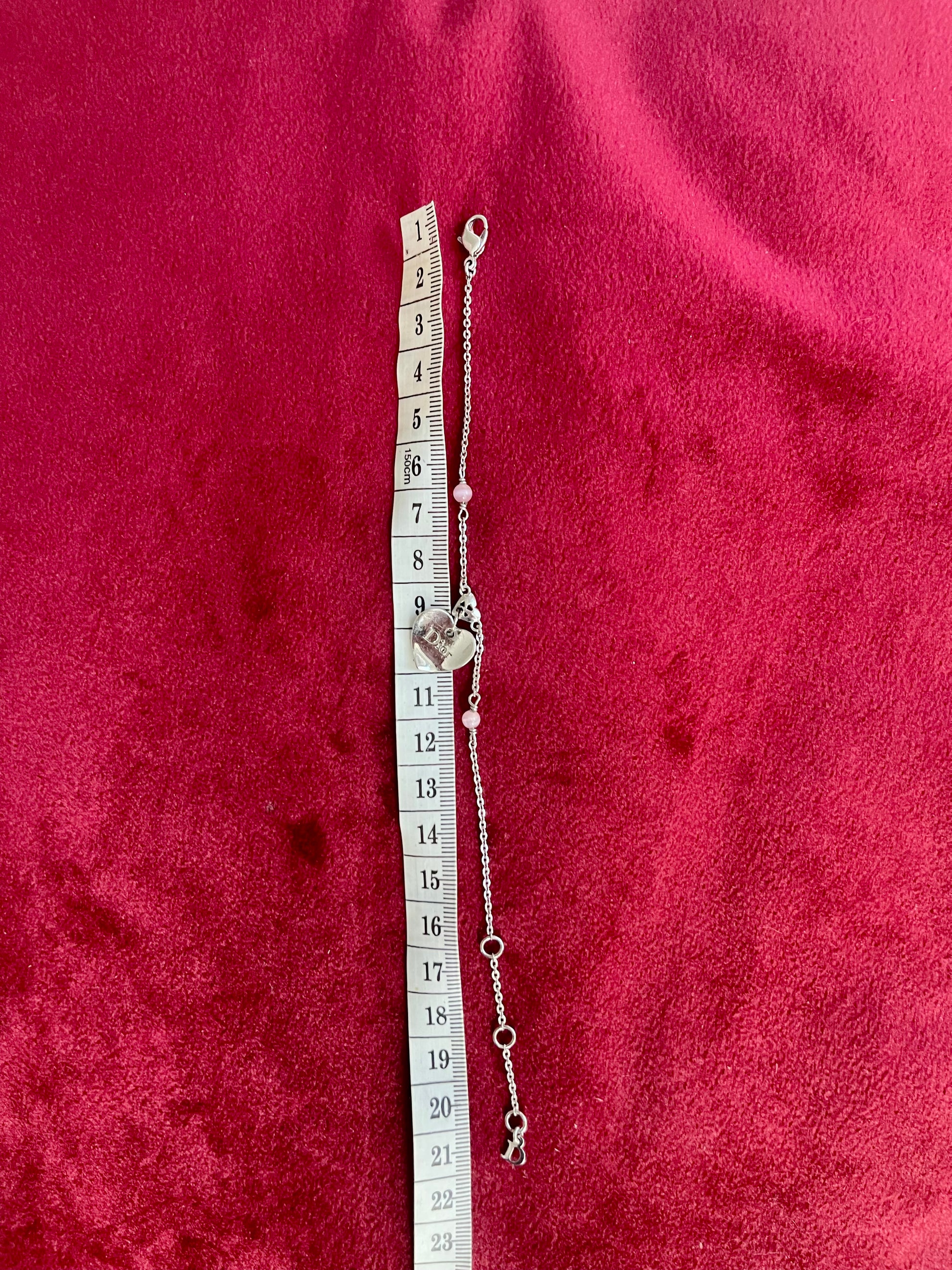 Using a measuring tape Vintage Dior silver tone rose beads chain bracelet with D charm signed 
