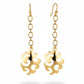Vintage Yves Saint Laurent long drop earrings upcycled from signed YSL pendants on white background 