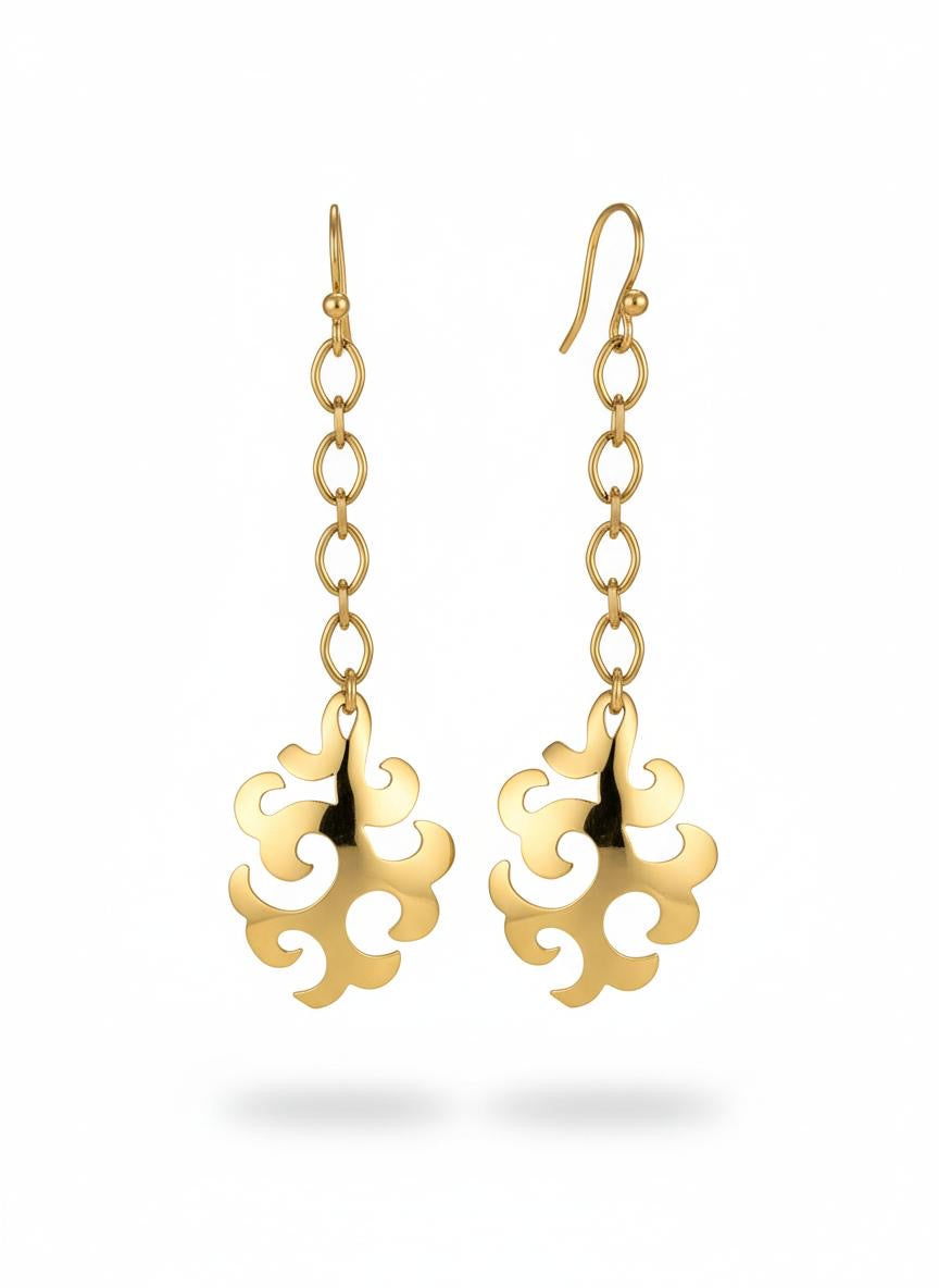 Vintage Yves Saint Laurent long drop earrings upcycled from signed YSL pendants on white background 