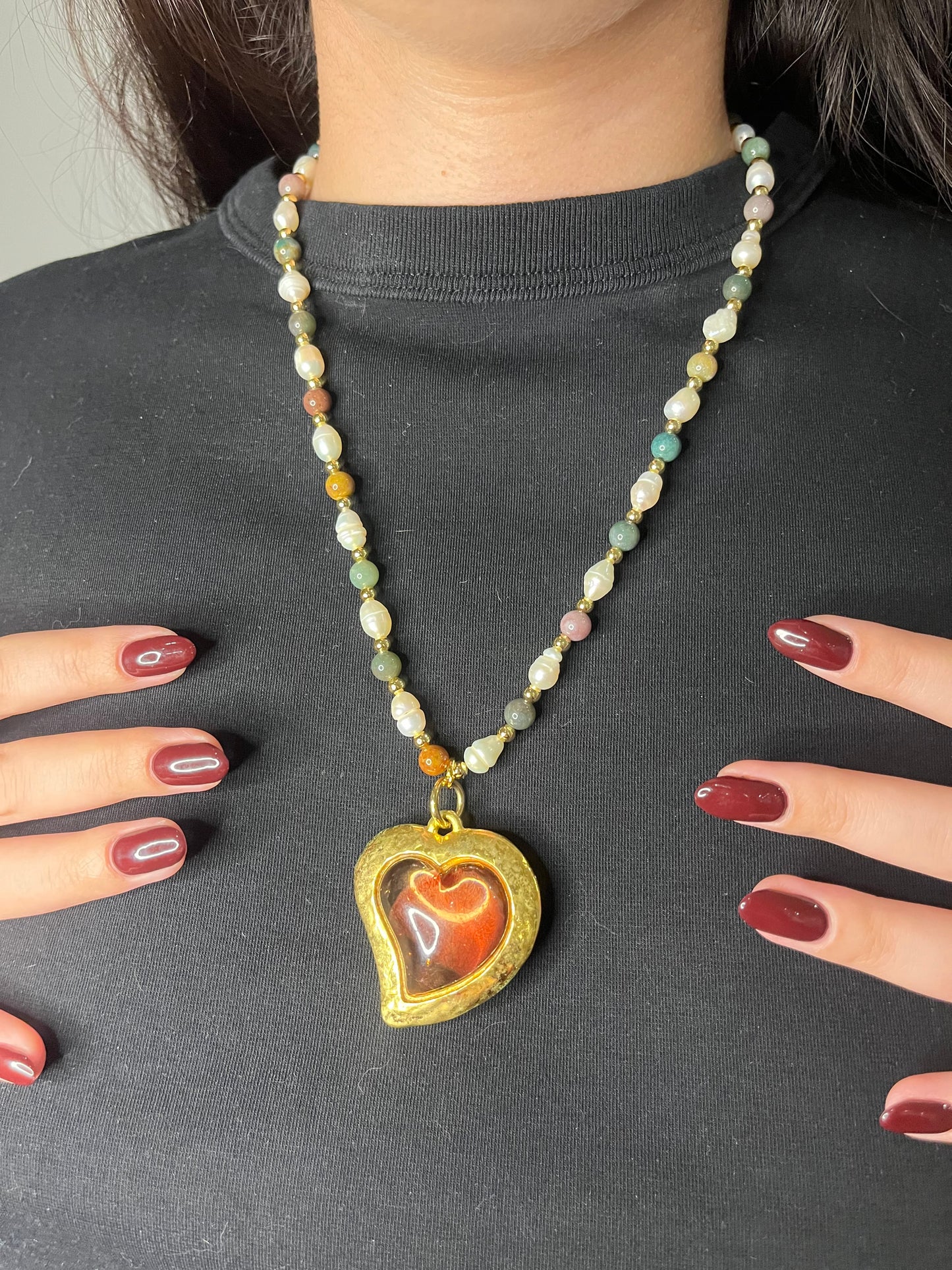 Vintage Yves Saint Laurent Flower petal pendant with a fresh water pearl and precious stones necklace, Worn by model in a black background 