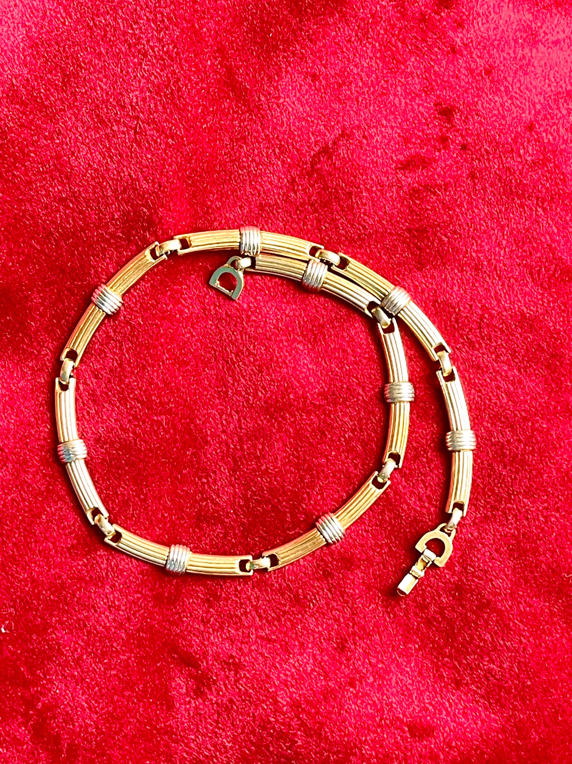Authentic vintage Christian Dior two-tone necklace featuring gold and silver-toned ribbed links. Timeless designer elegance perfect for any occasion.