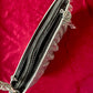 Top view on the One of a kind handmade Paco Rabanne repurposed silver pixel mesh bag showing the two compartments on a red background 