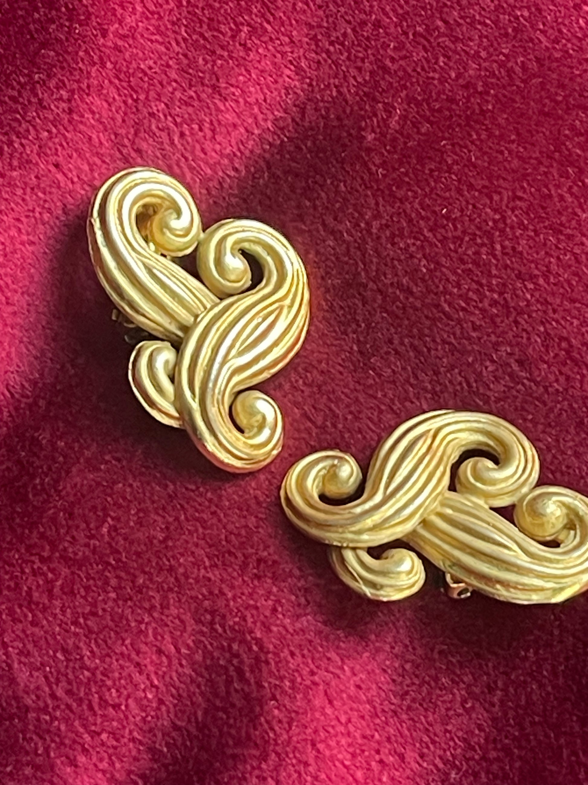 Pair of vintage Nina Ricci statement heart earrings with artistic swirling form